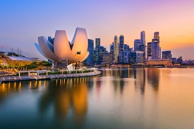 singapore skyline at the marina during twilight.