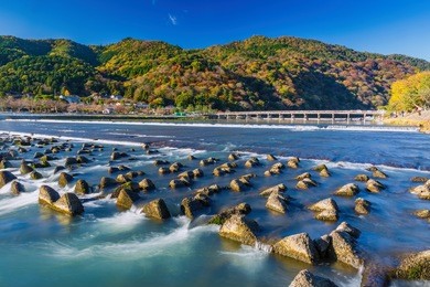 togetsukyo bridge over katsura river. togetsukyo bridge provides a panoramic view of arashiyama.