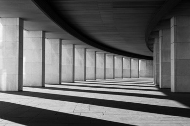 long tunnel with columns in black and white