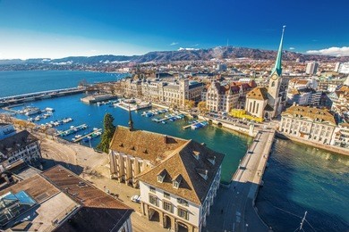 view of historic zurich city center with famous fraumunster church, limmat river and zurich lake from grossmunster church, switzerland