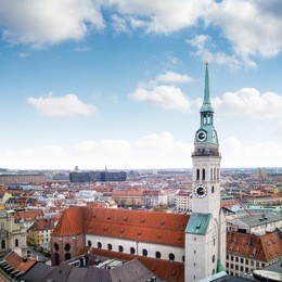 view overlooking the town of munich with a tower of the famous st. peter's church in the foreground.