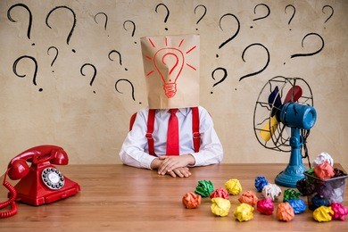 portrait of child businessman in office. think outside the box business idea concept