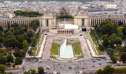 color dslr wide angle stock image of famous landmark trocadero and the palais de chaillot shot from above at the eiffel tower, paris, france. horizontal with city skyline and copy space for text.