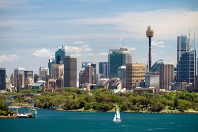 dramatic view at sydney city urban skyline from western plains with blue sky and clouds on a bright day