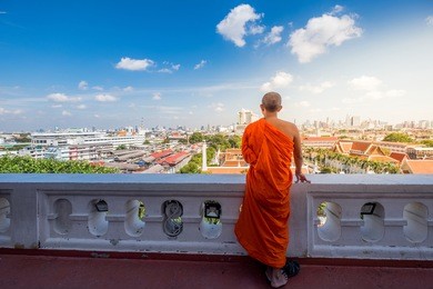unidentified buddhist monks in city view point at golden moutain temple, thailand 