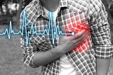 man having chest pain - heart attack, outdoors