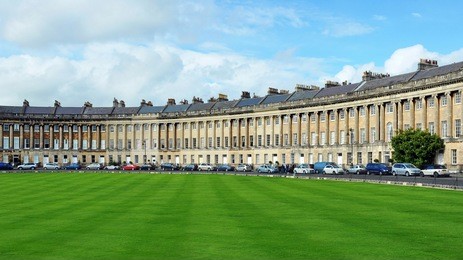 the royal crescent in the city of bath in england - the georgian era crescent comprises of luxury town houses and is one of the uk's foremost tourist attractions