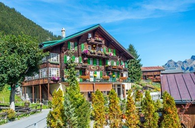 wood chalet in mountain village murren, switzerland.