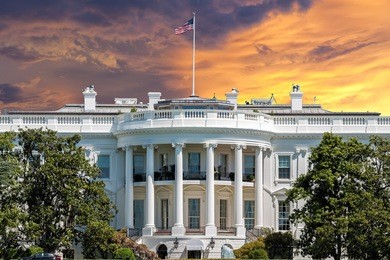 white house on deep red sunset background