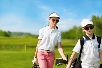 kids warming up at golf school at summer day