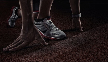 sport. runner. hands on starting line. close view