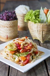 thai cuisine - thai papaya salad - thai papaya salad hot and spicy with sticky rice ( som tum - som tum thai )
