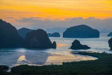 silhouette phang nga bay lanscape with mangrove forest in the early morning before sunrise.