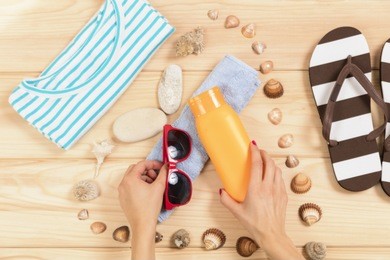 beach accessories on wooden board.

