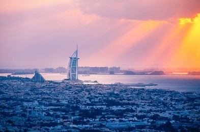 rooftop view of dubai at sunset with the seaside. 