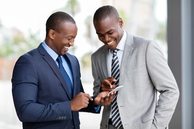 happy african businessmen using smart phone