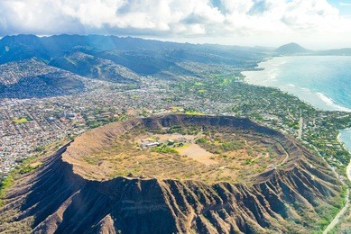 absolutely amazing aerial view on the hawaii island with a diamond head crater and honolulu city skyline view.