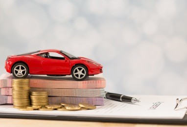car loan,money, banknote on agreement document or car insurance application form.