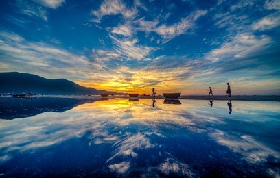 my khe beach is a beautiful beach in danang city ,  vietnam.  the sunrise was reflected in the pond bond before the beach. my khe beach is in  top 6 beautiful beach in the world by forbes magazine.  