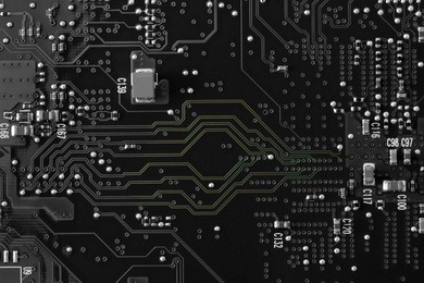 a black and white circuit board with natural green showing on the lines to show the communication highway of the circuitry. flat layout, copy space, use as a horizontal or vertical format.