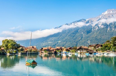 landscape  of small  fishing village with water reflection  on lake brienz, switzerland. 