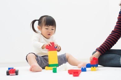 kid having fun with blocks