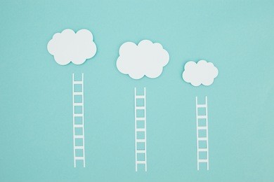 ladders to climb onto your cloud. conceptual paper craft image about cloud computing and themes about promotion.