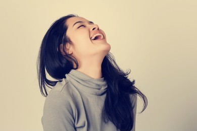 young happy asia woman is laughing. vintage tone filter.