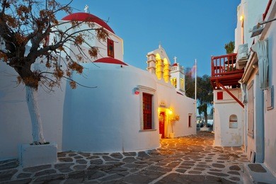 byzantine church in a street of mykonos town on early morning.