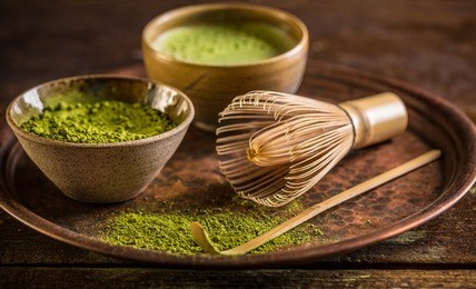 healthy green matcha tea in bowl 