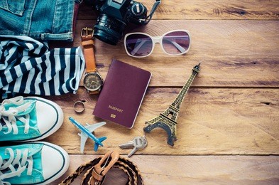 accessories and apparel for travel on a wooden floor - life style