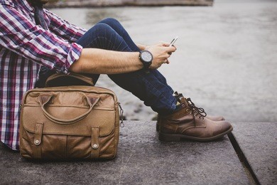 young handsome man wearing a fashionable outfit in the city