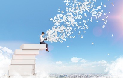 man sitting on cloud reading, letters flying from book. blue sky and city at background. paris. concept of reading.