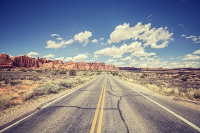 vintage stylized scenic road, arches national park, usa.