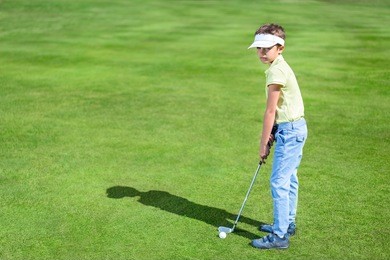 child on golf course
