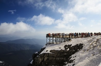 scenic point on jade dragon snow mountain, snow mountain on the day a clear blue sky. tourists are walking up snowy mountain, jade dragon snow mount, lijiang, yunnan, southern china, stairs, walkways
