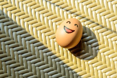 brown egg with happy face