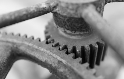 old rusty iron cog in black and white tone