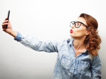 pretty hipster girl taking selfie. 