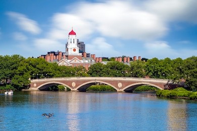 john w. weeks bridge with clock tower over charles river in harvard university campus boston 