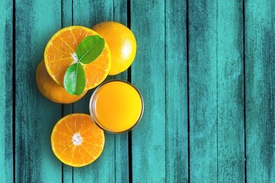 glass of orange juice from above on vintage wood table. empty ready for your orange juice, fruit product display or montage.