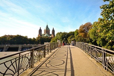 riverside with bridge across the isar river in munich, bavaria germany europe