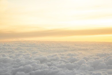 high above the clouds with beautiful sunset light
