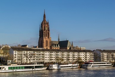 view of frankfurt cathedral from main river, germany. it is dedicated to saint bartholomew.
