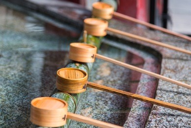 close up of japanes wooden ladle in shrine yufuin kyushu japan.