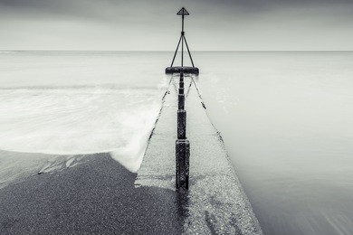 fine art long exposure black and white sea scape, minimalistic design with horizon line.