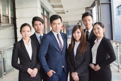 successful business team of asian in the city.