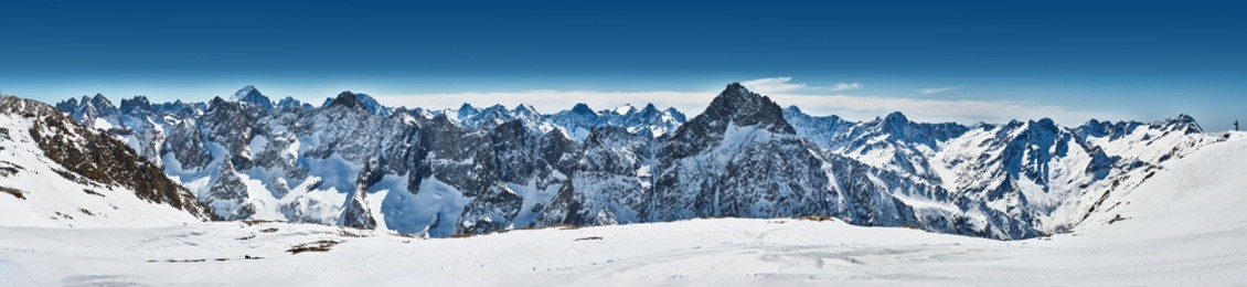 		panoramic view of the mountains. a panoramic view on alps winter mountains, les 2 alpes, france