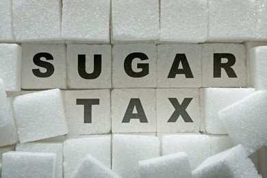 sugar cubes and "sugar tax" inscription