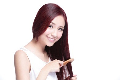 portrait of beautiful young woman brush wonderful hair isolated on white background, asian beauty